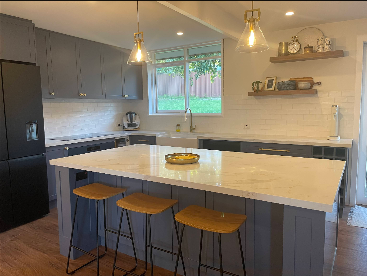 Two-tone grey kitchen with waterfall island