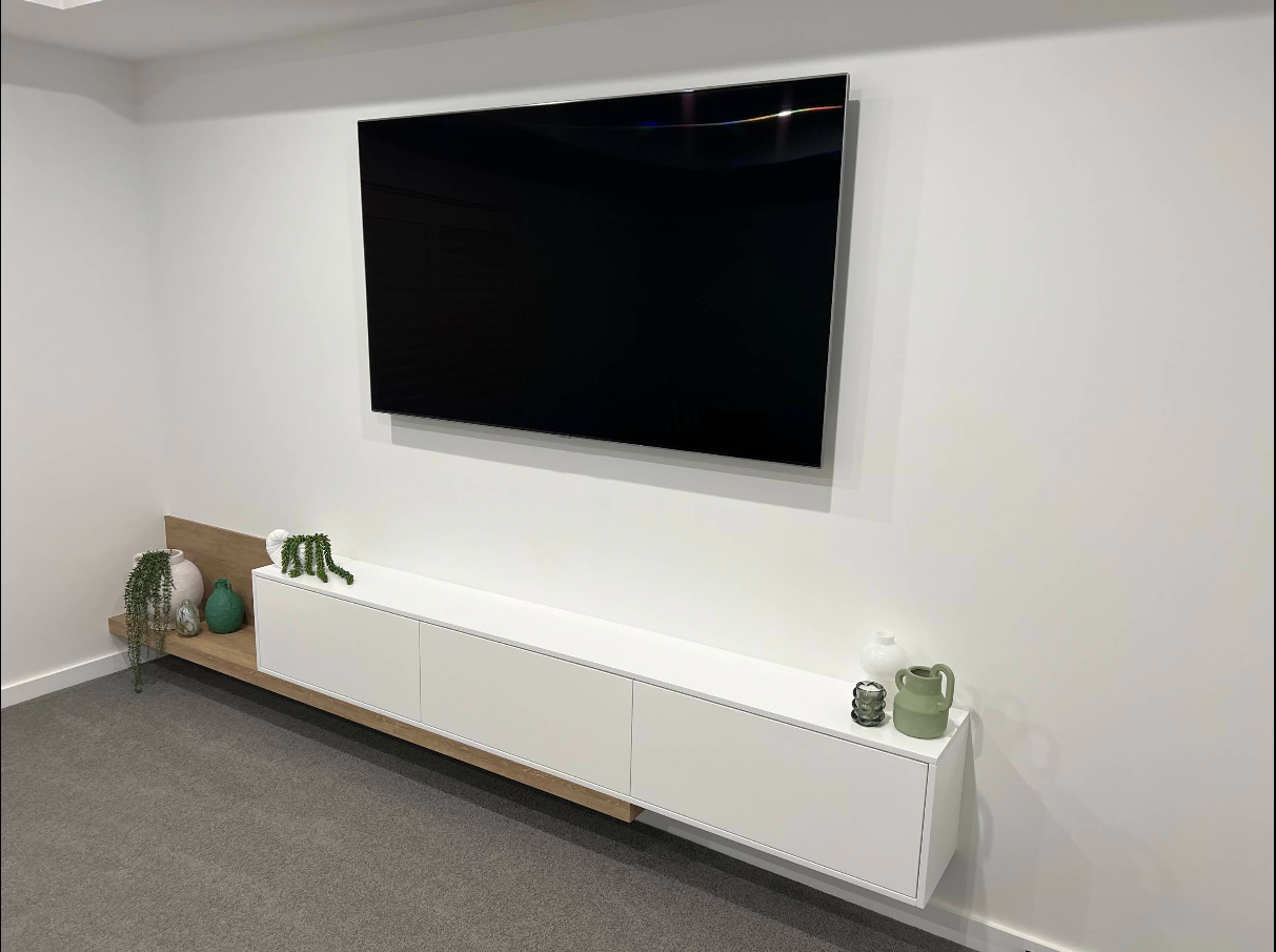 Floating white entertainment unit with timber accent